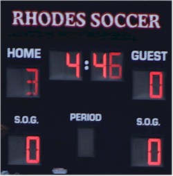 scoreboard: home (Trinity), visitor (Rhodes) 0